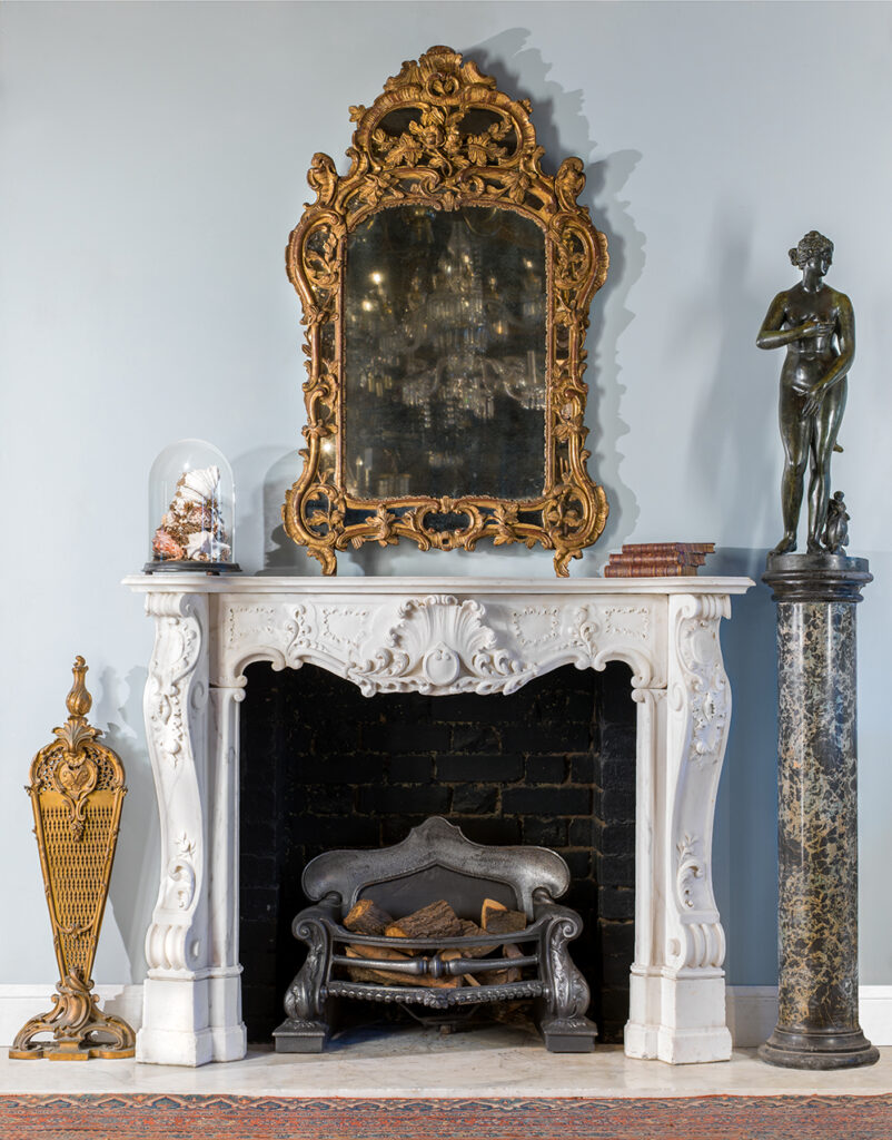 French rococo mirror and English rococo chimneypiece, both C18th (Westland London)